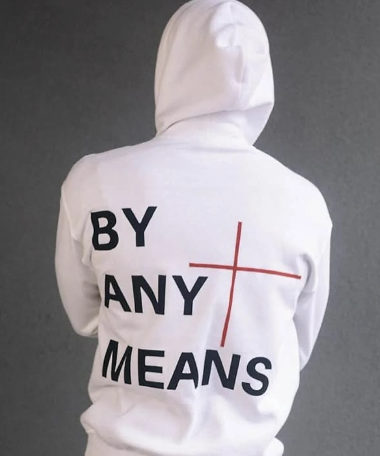 The back of a white hoodie reading By Any Means